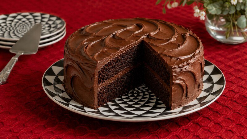 A rich slice of Black Magic Cake with dark chocolate layers and chocolate frosting